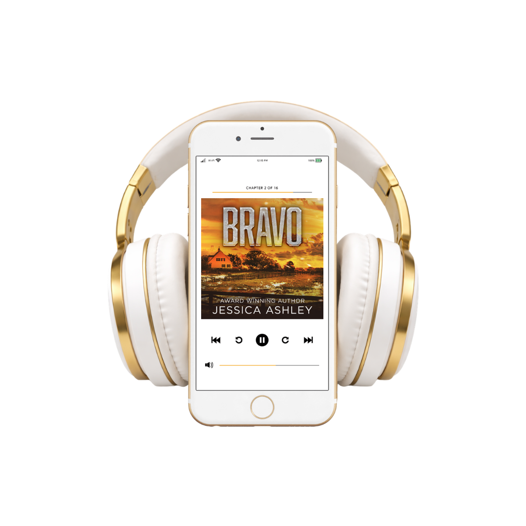 White and gold headphones with a smartphone displaying an audiobook titled 'Bravo' by Jessica Ashley.