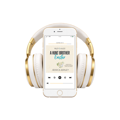 White and gold headphones with a smartphone displaying an audiobook on a white background