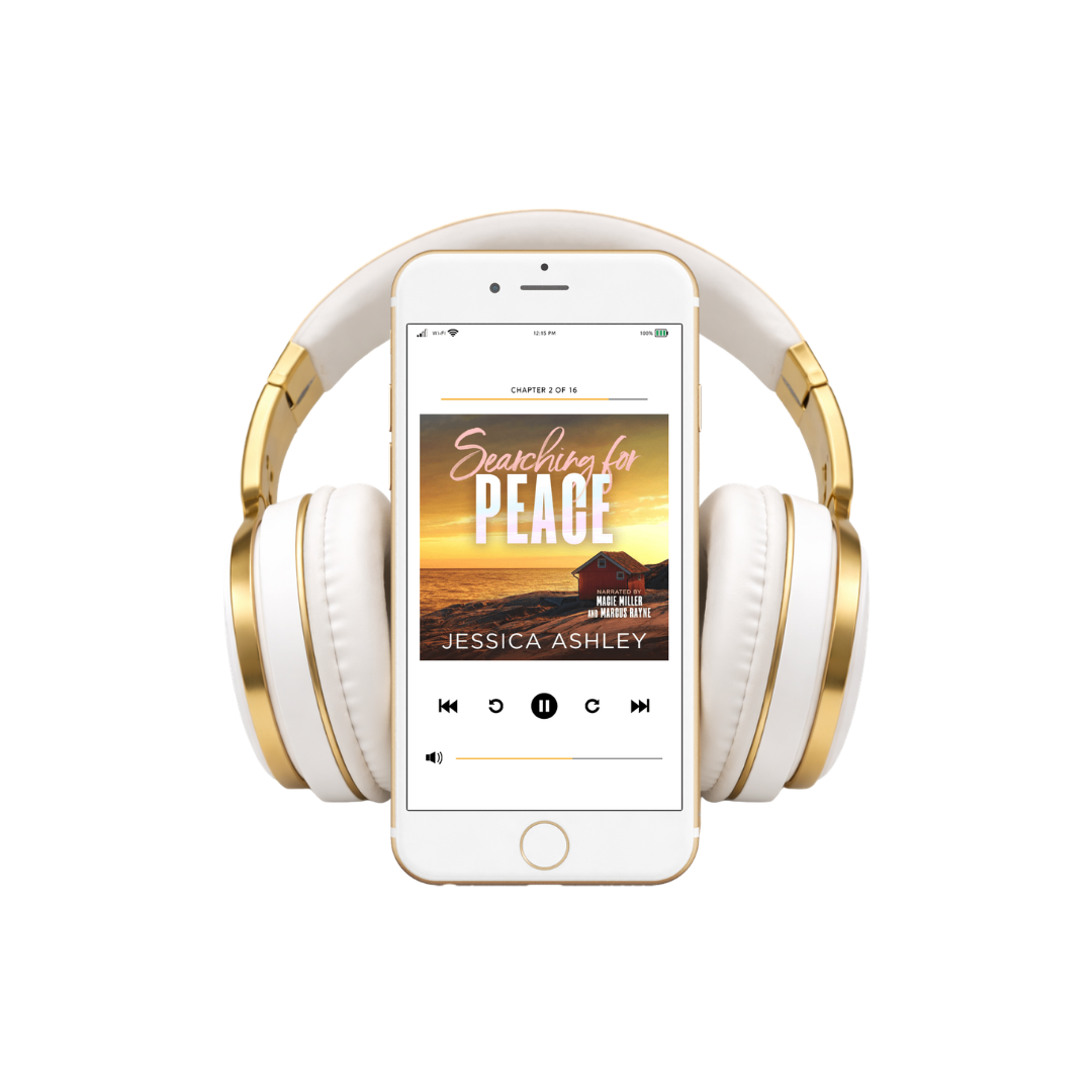 White and gold headphones with a smartphone displaying an audiobook titled 'Searching for Peace' by Jessica Ashley.