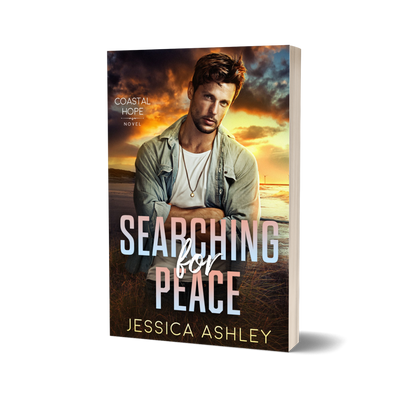 Book cover of 'Searching for Peace' by Jessica Ashley with a man on a beach.
